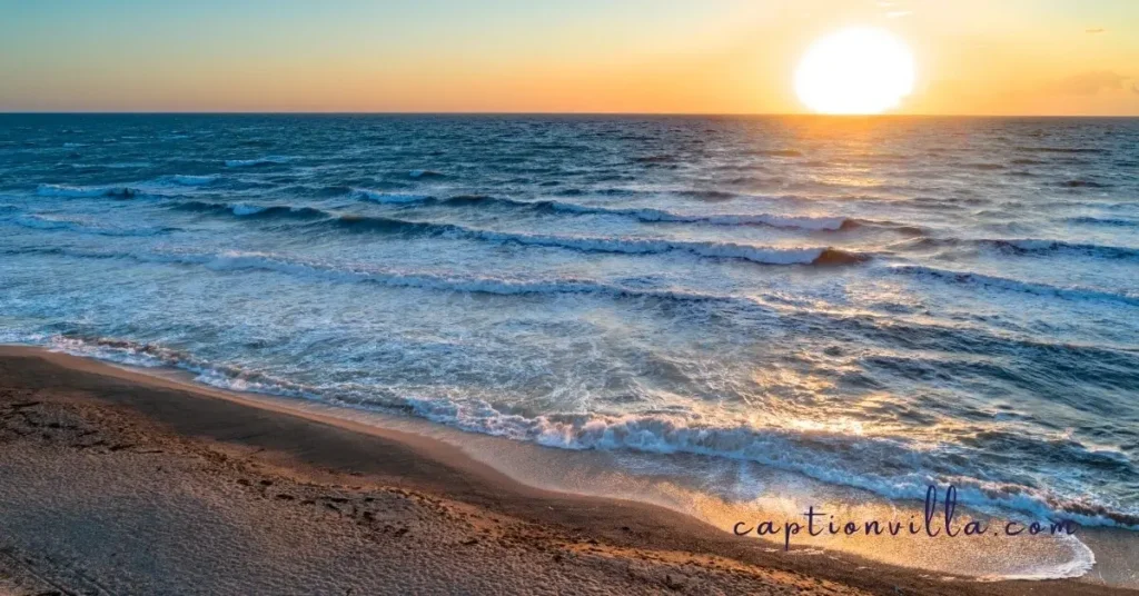 a stunning sunrise beach scene with soft golden light, perfect for capturing serene moments. check out beach captions for instagram ideas at captionvilla.com. #beachvibes #sunrisebeach #goldenhour #beachtherapy #captionvilla